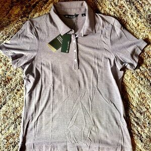 Travis Matthew women’s polo in Purple. Size L.